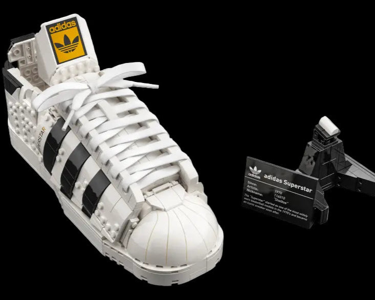 LEGO Adidas Originals Superstar sneaker model set number 10282, detailed brick-built shoe with display stand.